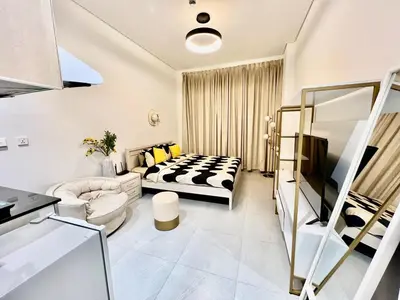 a living room with a bed and a couch at Karama Apple building in Dubai