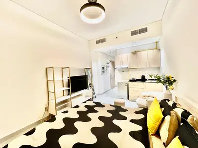 a living room with a black and white rug at Karama Apple building in Dubai