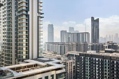 an aerial view of a city with tall buildings at STAY BY LATINEM Luxury 1BR Holiday Home CC 1806 Near Burj Khalifa in Dubai