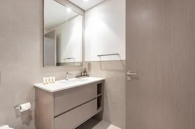 a bathroom with a sink and a mirror at Grande Residence, Downtown - 1 Bedroom Apartment - Allsopp & Allsopp in Dubai