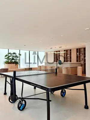 a ping pong table in a room at Stylish New Studio Apartment with Balcony in Dubai