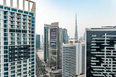 a view of a city with tall buildings at GuestReady - Studio l Canal Views | Business Bay in Dubai