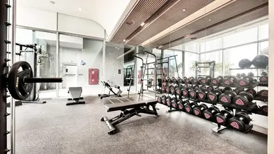 a gym with a row of tread machines in a room at Vida Residence Dubai Mall by Propigo in Dubai