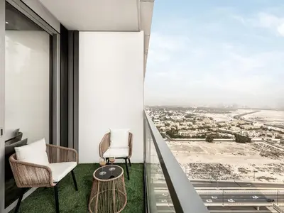 a view from the balcony of a building with chairs and a table at Vida Residence Dubai Mall by Propigo in Dubai