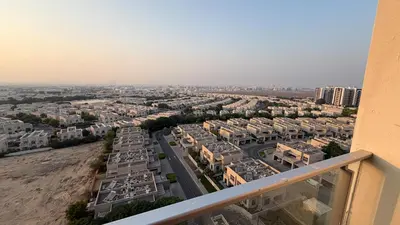 a view of a city from a balcony at Sleek 1BR Apt Free Pool & Gym Access in Dubai