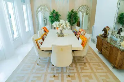 a dining room with a table and some chairs at World Class Luxurious 5 BDR Villa In Palm Jumeriah in Dubai