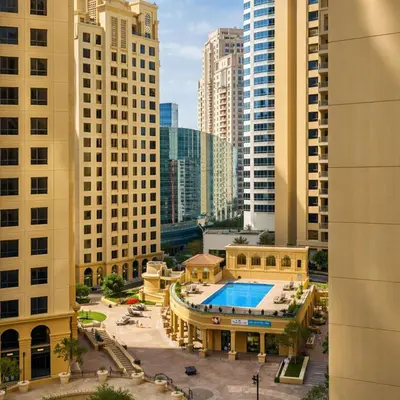 a view of a pool in a city with tall buildings at Dubai Beach Living JBR Hostel in Dubai