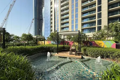 a rendering of a garden with two dogs in the water at Cozy 2BR Aykon City Near Downtown - Pool and Gym in Dubai