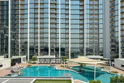an overhead view of a large apartment building with a pool at Sobha Crest Luxury Apartments in Dubai