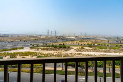 a view of a highway from a balcony at Modern Amenities - Great Community in Dubai