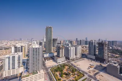 an aerial view of a city with tall buildings at Modern Studio on High Floor with Stunning City Views near Circle Mall and Community Parks - Binghatti Tulip, JVC - by Deluxe Holiday Homes in Dubai