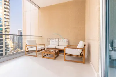 a balcony with two chairs and a table at Next to Marina Canal 1BR, Easily Accessible from the Tram, a Short Stroll to Marina Beach and The Walk, Beauport X1, Dubai Marina - by Deluxe Holiday Homes in Dubai