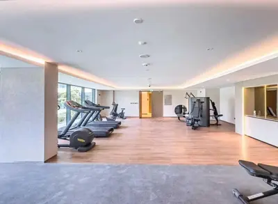 a gym with treadmills and machines in a room at Elegant 1 Bedroom with Balcony in City Walk in Dubai