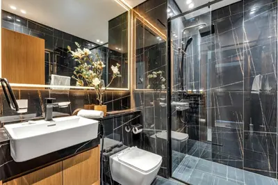 a bathroom with a sink and a shower at GuestReady - High floor Luxury with a Private Pool in Dubai