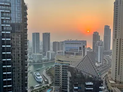 a view of a city with a river and buildings at Marina Sunset Haven - Breathtaking Views in Dubai