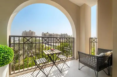a balcony with a table and chairs and a view at Luxury 1BR in Madinat Jumeirah Living in Dubai