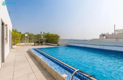 a swimming pool on the side of a building at Blue Breeze Modern 2BR Apartment Near Downtown in Dubai