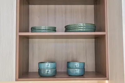 a group of green bowls sitting on a shelf at Vida Residences - Luxury & Serenity - Creek Beach in Dubai