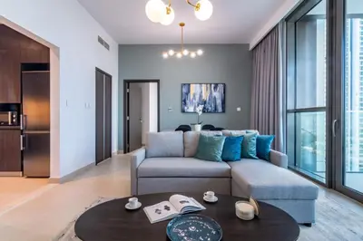 a living room with a couch and a table at Downtown views 1 Bedroom 5 PAX direct Dubai mall in Dubai