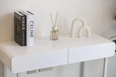 a white kitchen counter with a sink and books at Beachfront 1BR with Private Beach Access in Dubai