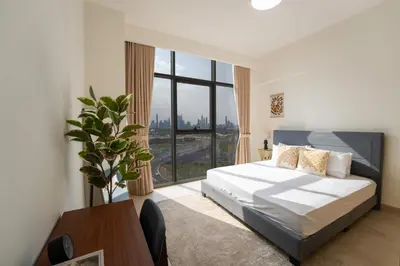 a bedroom with a bed and a large window at EasyGo - Chic 2-Bedroom with Dubai Skyline View in Dubai