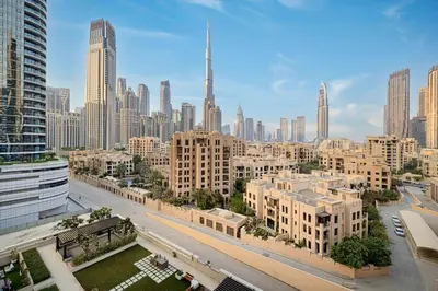 a view of a large city with tall buildings at Premium 3BR apartment with Burj Khalifa view, Downtown Dubai in Dubai