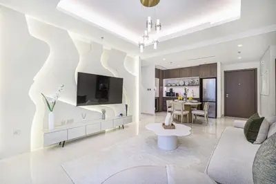 a living room with a couch and a table at Palace Beach Residences By Luxe Living - Palm & Marina View in Dubai