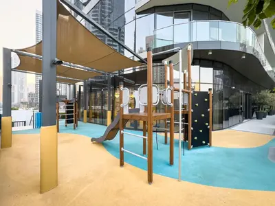 a playground in a building with a slide at 1BR in GRANDE with Balcony I Amazing INFINITY POOL I Steps to Dubai Mall & Fountain in Dubai