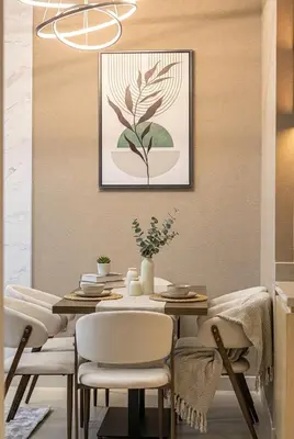 a dining room with a table and chairs at Vida Dubai Mall! 2 Bedroom with Burj Khalifa View! Direct Access to Dubai Mall in Dubai