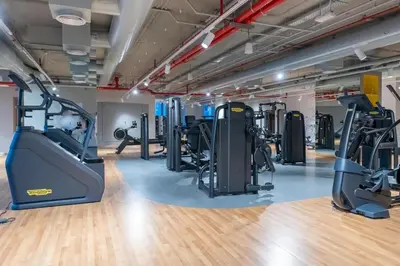 a gym with treadmills and elliptical machines at King 2 Bedroom With Burj Khalifa View & Dubai Mall Access in Dubai