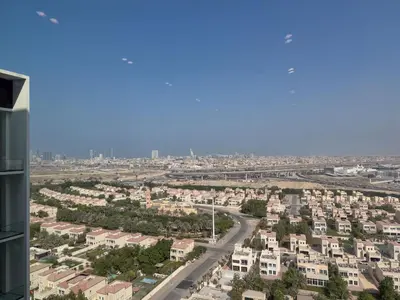 an aerial view of a city with houses at StayShort - Stylish Boho Studio in JVC Dubai Staycation Sleeps 2 in Dubai