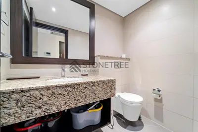 a bathroom with a sink and a toilet at Sea View 1BR - Private Beach Access Anantara in Dubai