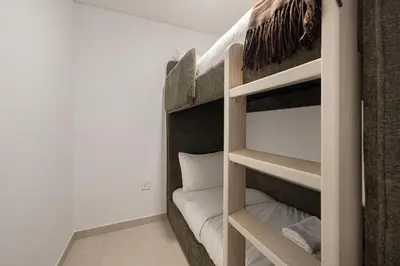 a bunk bed in a room with a bunk bedscribed at Luxury 4BR Burj Khalifa View Dubai Mall in Dubai
