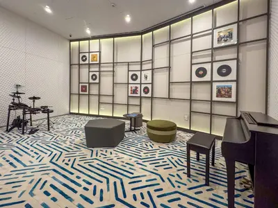 a room with a room with a piano and a room with a floor at Frank Porter - Liv Marina in Dubai