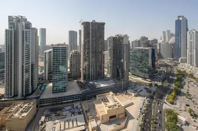 an aerial view of a city with tall buildings at Frank Porter - Boulevard Walk Downtown in Dubai