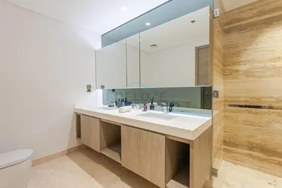 a bathroom with a sink and a mirror at Burj Khalifa Views, Walking Distance to Dubai Mall and Downtown Boulevard - The Sterling West House, Business Bay by Deluxe Holiday Homes in Dubai