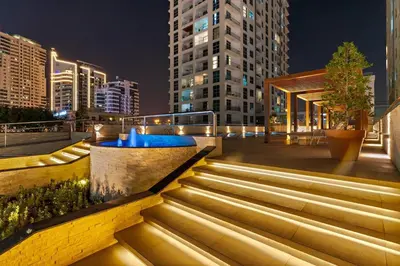 a set of stairs in a city at night at Cozy Apartment in Central Dubai Marina near Beach in Dubai
