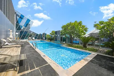 a swimming pool on the side of a building at Relax in Comfort with Modern Amenities, Steps from Burj Khalifa and Dubai Mall in Dubai