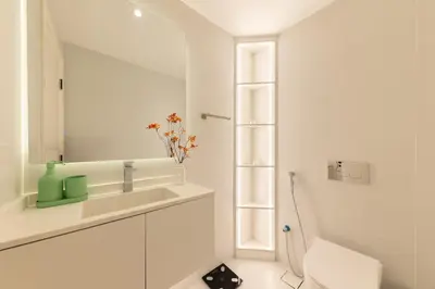 a white bathroom with a sink and a mirror at Spacious 2BR in Sulafa Tower - Dubai Marina in Dubai
