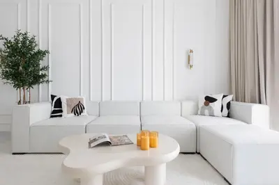 a white living room with a white couch and a table at Spacious 2BR in Sulafa Tower - Dubai Marina in Dubai