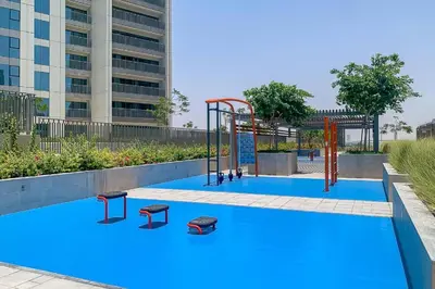 a playground in a pool with blue paint at Brand New 1BR, Downtown View, 5 Min Dubai Mall in Dubai