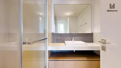 a bathroom with a sink and a mirror at Stylish2BR Apartment Iconic The Grand LH in Dubai