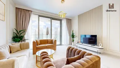 a living room with couches and a tv at Stylish2BR Apartment Iconic The Grand LH in Dubai
