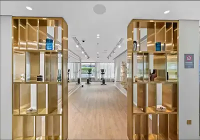 a large room with wooden shelves in a building at Cozy 1BD Apartment in Grand Bleu, Emaar Beachfront in Dubai