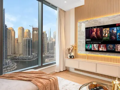 a bedroom with a large window with a tv at Livora Stays - Marina Promenade , Walk to JBR in Dubai