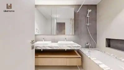 a bathroom with a sink and a tub and a mirror at Grand Apartment -3 Bedrooms in Dubai