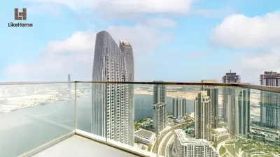 a view of the city from the balcony of a skyscraper at Grand Apartment -3 Bedrooms in Dubai