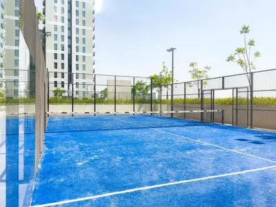 a tennis court in the middle of a building at Modern & Stylish Stay in 1BR Socio Dubai Hills in Dubai