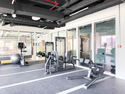 a gym with treadmills and ellipticals in a building at Modern & Stylish Stay in 1BR Socio Dubai Hills in Dubai