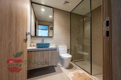 a bathroom with a toilet and a sink and a mirror at Brand New with Burj Khalifa View in Dubai